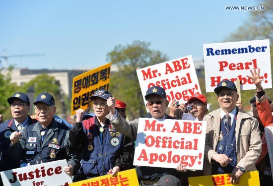 Dozens of protesters shout slogans in front of Capitol Hill as Japanese Prime Minister Shinzo Abe pays a visit to White House in Washington D.C., capital of the United States, April 28, 2015. Nearly 200 people held signs and shouted slogans in a protest against Abe's handling of history issues, demanding the Japanese leader to unequivocally apologize for his country's wartime crimes here on Tuesday. (Xinhua/Bao Dandan) Dozens of protesters shout slogans in front of Capitol Hill as Japanese Prime Minister Shinzo Abe pays a visit to White House in Washington D.C., capital of the United States, April 28, 2015. Nearly 200 people held signs and shouted slogans in a protest against Abe's handling of history issues, demanding the Japanese leader to unequivocally apologize for his country's wartime crimes here on Tuesday. (Xinhua/Bao Dandan)