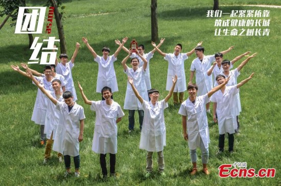 Would-be male nurses studying at the medical school of Jinhua Polytechnic, located in East China’s Zhejiang province, pose for photos to mark International Nurses Day on May 12, 2015. The students, who are completing a nursing program, say they are proud to work in the female-dominated profession. Official data released by the health authority showed there were 45,000 registered male nurses in 2012, an increase from 39,000 in 2009. (Photo: China News Service/Lu Huiping) Would-be male nurses studying at the medical school of Jinhua Polytechnic, located in East China’s Zhejiang province, pose for photos to mark International Nurses Day on May 12, 2015. The students, who are completing a nursing program, say they are proud to work in the female-dominated profession. Official data released by the health authority showed there were 45,000 registered male nurses in 2012, an increase from 39,000 in 2009. (Photo: China News Service/Lu Huiping)