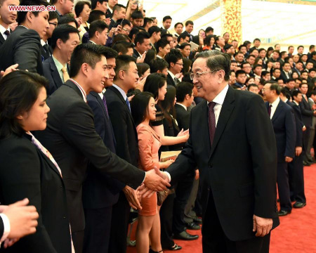 Yu Zhengsheng (R, front), chairman of the National Committee of the Chinese People's Political Consultative Conference, meets with representatives attending the Discovery Trip to China for Eminent Young Overseas Chinese 2015 and poses for a group photo with them in Beijing, capital of China, May 28, 2015. (Xinhua/Rao Aimin) Yu Zhengsheng (R, front), chairman of the National Committee of the Chinese People's Political Consultative Conference, meets with representatives attending the Discovery Trip to China for Eminent Young Overseas Chinese 2015 and poses for a group photo with them in Beijing, capital of China, May 28, 2015. (Xinhua/Rao Aimin)