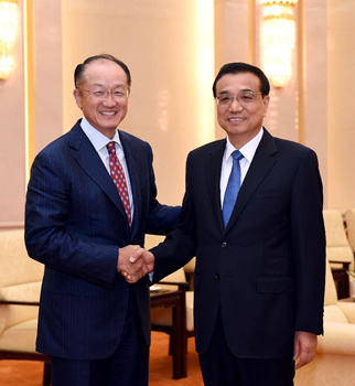 Chinese Premier Li Keqiang (R) shakes hands with World Bank President Jim Yong Kim at the Great Hall of the People in Beijing, China, July 16, 2015. (Photo: Xinhua/Rao Aimin) Chinese Premier Li Keqiang (R) shakes hands with World Bank President Jim Yong Kim at the Great Hall of the People in Beijing, China, July 16, 2015. (Photo: Xinhua/Rao Aimin)