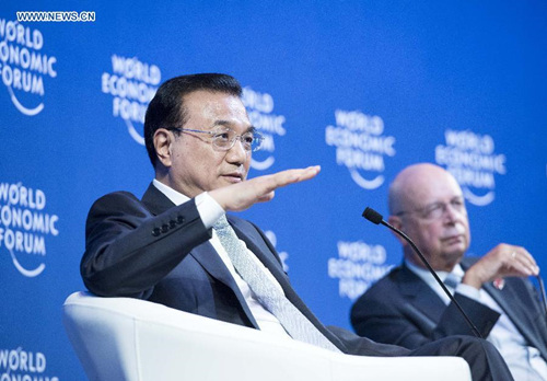 Chinese Premier Li Keqiang (L) exchanges views with Klaus Schwab, founder and executive chairman of the World Economic Forum (WEF) and other participants at the World Economic Forum (WEF) in Dalian, northeast China's Liaoning Province, Sept. 9, 2015. The three-day meeting will last from Sept. 9 to 11.(Photo: Xinhua/Wang Ye) Chinese Premier Li Keqiang (L) exchanges views with Klaus Schwab, founder and executive chairman of the World Economic Forum (WEF) and other participants at the World Economic Forum (WEF) in Dalian, northeast China's Liaoning Province, Sept. 9, 2015. The three-day meeting will last from Sept. 9 to 11.(Photo: Xinhua/Wang Ye)