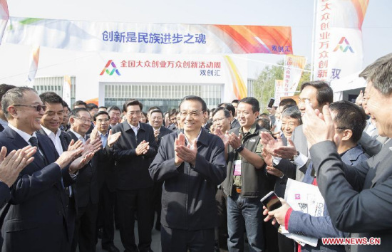 Chinese Premier LiKeqiang (C) inspects the exhibition of mass entrepreneurship and innovation week in Beijing, capital of China, Oct. 19, 2015. The mass entrepreneurship and innovation week kicked off on Monday incities including Beijing, Shanghai, Shenzhen, Wuhan, Xi'an,Chengdu, Hefei and Shenyang. (Photo: Xinhua/Huang Jingwen) Chinese Premier LiKeqiang (C) inspects the exhibition of mass entrepreneurship and innovation week in Beijing, capital of China, Oct. 19, 2015. The mass entrepreneurship and innovation week kicked off on Monday incities including Beijing, Shanghai, Shenzhen, Wuhan, Xi'an,Chengdu, Hefei and Shenyang. (Photo: Xinhua/Huang Jingwen)