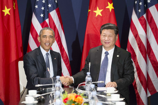 Chinese President Xi Jinping (R) meets with his U.S. counterpart Barack Obama in Paris, France, Nov. 30, 2015. (Photo by Huang Jingwen/Xinhua) Chinese President Xi Jinping (R) meets with his U.S. counterpart Barack Obama in Paris, France, Nov. 30, 2015. (Photo by Huang Jingwen/Xinhua)