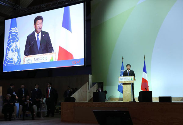President Xi Jinping is seen on a giant screen as he delivers a speech for the opening day of the World Climate Change Conference 2015 (COP21) at Le Bourget, near Paris, France, November 30, 2015.(Photo/Xinhua) President Xi Jinping is seen on a giant screen as he delivers a speech for the opening day of the World Climate Change Conference 2015 (COP21) at Le Bourget, near Paris, France, November 30, 2015.(Photo/Xinhua)