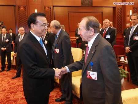 Chinese Premier Li Keqiang (L) shakes hands with Maurice R. Greenberg during a meeting with overseas delegates attending the China Development Forum in Beijing, capital of China, March 21, 2016. (Xinhua/Pang Xinglei) Chinese Premier Li Keqiang (L) shakes hands with Maurice R. Greenberg during a meeting with overseas delegates attending the China Development Forum in Beijing, capital of China, March 21, 2016. (Xinhua/Pang Xinglei)