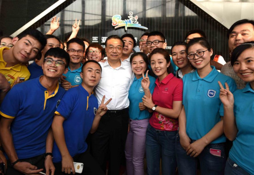 Chinese Premier Li Keqiang (3rd L, front) poses for photos with people at Sanya Resident & Visitor Information Center in Sanya, south China's Hainan Province, March 22, 2016. Li had an inspection tour in Sanya and Qionghai of Hainan Province from March 22 to 25, during which Li presided over the 1st Lancang-Mekong Cooperation Leaders' Meeting and attended the Boao Forum for Asia (BFA) annual conference 2016. (Xinhua/Rao Aimin) Chinese Premier Li Keqiang (3rd L, front) poses for photos with people at Sanya Resident & Visitor Information Center in Sanya, south China's Hainan Province, March 22, 2016. Li had an inspection tour in Sanya and Qionghai of Hainan Province from March 22 to 25, during which Li presided over the 1st Lancang-Mekong Cooperation Leaders' Meeting and attended the Boao Forum for Asia (BFA) annual conference 2016. (Xinhua/Rao Aimin)