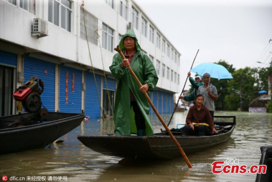 Residents use a boat for transportation in the flood-hit Langxi County of Xuancheng City, East China’s Anhui Province, July 11, 2016. (Photo/IC) Residents use a boat for transportation in the flood-hit Langxi County of Xuancheng City, East China’s Anhui Province, July 11, 2016. (Photo/IC)