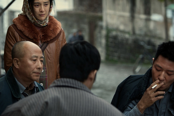 A smoking scene from the movie I Am Not Madame Bovary, which won the Dirty Ashtray Award this year. Provided To China Daily