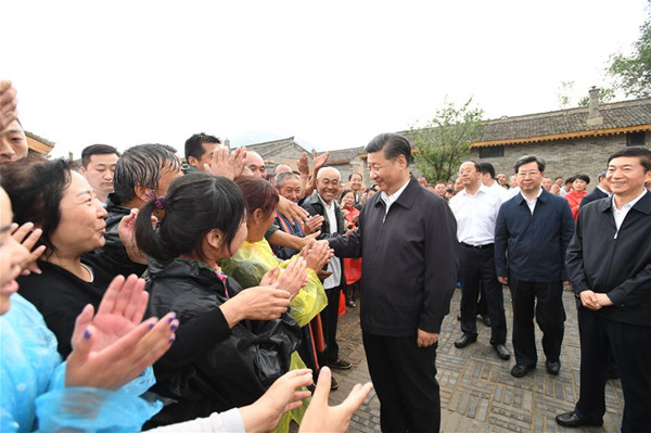 Chinese President Xi Jinping meets with local villagers at Songjiagou New Village, a centralized resettlement site under the approach of alleviating poverty through relocation, in Kelan County of Xinzhou City, north China's Shanxi Province, June 21, 2017. Xi had a three-day inspection tour in Shanxi from Wednesday. (Xinhua/Li Xueren) Chinese President Xi Jinping meets with local villagers at Songjiagou New Village, a centralized resettlement site under the approach of alleviating poverty through relocation, in Kelan County of Xinzhou City, north China's Shanxi Province, June 21, 2017. Xi had a three-day inspection tour in Shanxi from Wednesday. (Xinhua/Li Xueren)