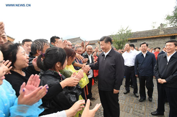 Chinese President Xi Jinping meets with local villagers at Songjiagou New Village, a centralized resettlement site under the approach of alleviating poverty through relocation, in Kelan County of Xinzhou City, north China's Shanxi Province, June 21, 2017. Xi had a three-day inspection tour in Shanxi from Wednesday. (Xinhua/Li Xueren) Chinese President Xi Jinping meets with local villagers at Songjiagou New Village, a centralized resettlement site under the approach of alleviating poverty through relocation, in Kelan County of Xinzhou City, north China's Shanxi Province, June 21, 2017. Xi had a three-day inspection tour in Shanxi from Wednesday. (Xinhua/Li Xueren)