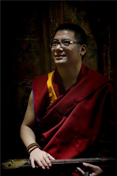 Orgyan Chopel, a Living Buddha, gives the sacred art of thangka a modern look by using symbols. In his paintings, Chopel includes poems, which express Buddhist thoughts. (Photo provided to China Daily) Orgyan Chopel, a Living Buddha, gives the sacred art of thangka a modern look by using symbols. In his paintings, Chopel includes poems, which express Buddhist thoughts. (Photo provided to China Daily)