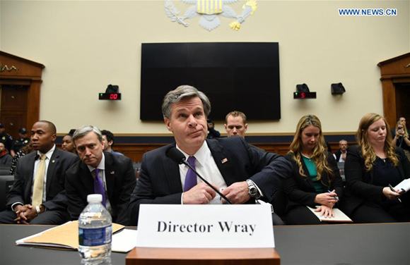 FBI Director Christopher Wray (C) arrives for a House Judiciary Committee hearing on Capitol Hill in Washington D.C., the United States, Dec. 7, 2017. FBI Director Christopher Wray defended his agency on Thursday amid sharp criticism from U.S. President Donald Trump. (Xinhua/Yin Bogu) FBI Director Christopher Wray (C) arrives for a House Judiciary Committee hearing on Capitol Hill in Washington D.C., the United States, Dec. 7, 2017. FBI Director Christopher Wray defended his agency on Thursday amid sharp criticism from U.S. President Donald Trump. (Xinhua/Yin Bogu)
