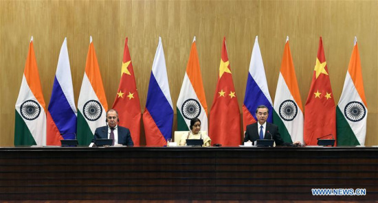 Chinese Foreign Minister Wang Yi (R) addresses a press conference after the 15th trilateral meeting of the foreign ministers of China, Russia and India with his Russian counterpart Sergei Lavrov (L) and Indian counterpart Sushma Swaraj in New Delhi, India, on Dec. 11, 2017. (Xinhua/Zhang Naijie) Chinese Foreign Minister Wang Yi (R) addresses a press conference after the 15th trilateral meeting of the foreign ministers of China, Russia and India with his Russian counterpart Sergei Lavrov (L) and Indian counterpart Sushma Swaraj in New Delhi, India, on Dec. 11, 2017. (Xinhua/Zhang Naijie)