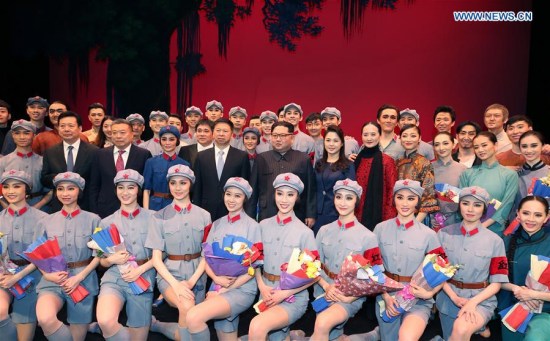 Kim Jong Un, top leader of the Democratic People's Republic of Korea, and his wife Ri Sol Ju pose for a group photo with dancers after watching the ballet The Red Detachment of Women performed by a visiting Chinese art troupe in Pyongyang, the Democratic People's Republic of Korea, April 16, 2018. (Xinhua/Yao Dawei) Kim Jong Un, top leader of the Democratic People's Republic of Korea, and his wife Ri Sol Ju pose for a group photo with dancers after watching the ballet The Red Detachment of Women performed by a visiting Chinese art troupe in Pyongyang, the Democratic People's Republic of Korea, April 16, 2018. (Xinhua/Yao Dawei)