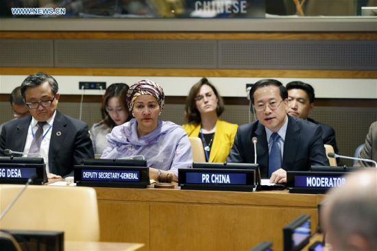 China's Permanent Representative to the United Nations Ma Zhaoxu (R) addresses the high-level symposium