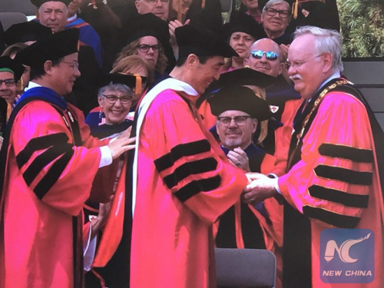 Chinese filmmaker Zhang Yimou (C) received an honorary Doctor of Humanize Letters from the Boston University at its 145th Commencement on May 20, 2018. (Xinhua Photo/Dong Ding) Chinese filmmaker Zhang Yimou (C) received an honorary Doctor of Humanize Letters from the Boston University at its 145th Commencement on May 20, 2018. (Xinhua Photo/Dong Ding)