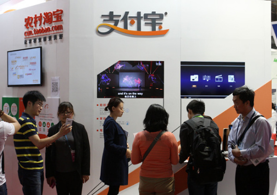 Alipay, the third-party online payment arm of Alibaba Group Holding Ltd, promotes its rural payment services and rural e-commerce at an expo in Beijing on Wednesday. (Photo/China Daily) Alipay, the third-party online payment arm of Alibaba Group Holding Ltd, promotes its rural payment services and rural e-commerce at an expo in Beijing on Wednesday. (Photo/China Daily)