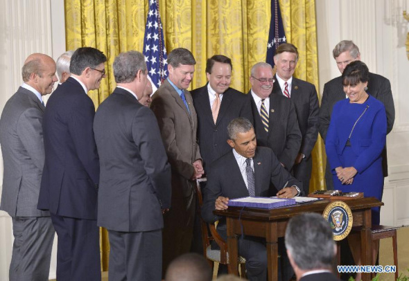 U.S. President Barack Obama signs acts in the East Room of the White House in Washington, D.C., the United States, on June 29, 2015. (Photo: Xinhua/Yin Bogu) U.S. President Barack Obama signs acts in the East Room of the White House in Washington, D.C., the United States, on June 29, 2015. (Photo: Xinhua/Yin Bogu)