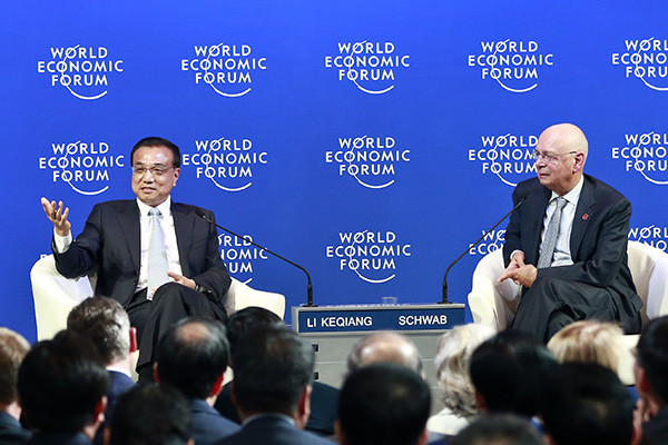 Premier Li Keqiang meets with Klaus Schwab, founder and executive chairman of the World Economic Forum, and other global corporate leaders at the 2015 Summer Davos forum in Dalian, Liaoning province, on Wednesday. (Photo/China Daily by Feng Yongbin) Premier Li Keqiang meets with Klaus Schwab, founder and executive chairman of the World Economic Forum, and other global corporate leaders at the 2015 Summer Davos forum in Dalian, Liaoning province, on Wednesday. (Photo/China Daily by Feng Yongbin)