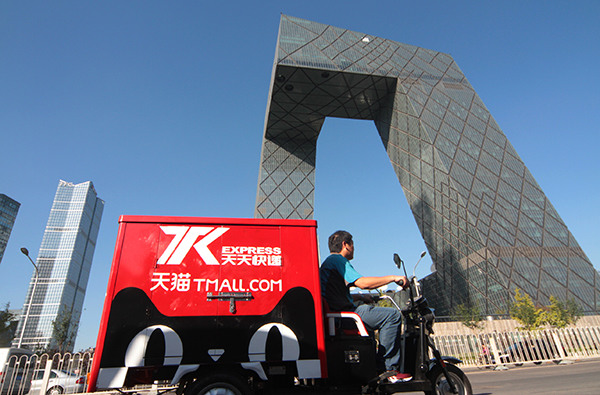 A delivery cart with the logo of Tmall.com, Alibaba's B2C platform, passes the CCTV building in Beijing. (Photo: China Daily/Wu Changqing) A delivery cart with the logo of Tmall.com, Alibaba's B2C platform, passes the CCTV building in Beijing. (Photo: China Daily/Wu Changqing)