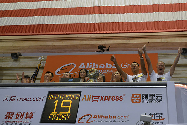 Representatives of Alibaba Group hail the company's IPO at the New York Stock Exchange on Sept 19, 2014. (Photo/Xinhua) Representatives of Alibaba Group hail the company's IPO at the New York Stock Exchange on Sept 19, 2014. (Photo/Xinhua)