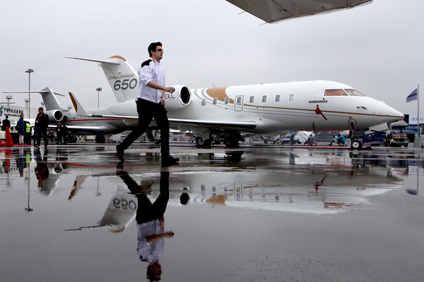 A business jet, made by Bombardier Inc, is on display at the Asian Business Aviation Conference and Exhibition in Shanghai, which opens on Tuesday. (Gao Erqiang/China Daily) A business jet, made by Bombardier Inc, is on display at the Asian Business Aviation Conference and Exhibition in Shanghai, which opens on Tuesday. (Gao Erqiang/China Daily)