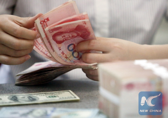 A worker counts Chinese currency Renminbi (RMB) at a bank in Linyi, east China's Shandong Province, Aug. 11, 2015. (Xinhua/Zhang Chunlei) A worker counts Chinese currency Renminbi (RMB) at a bank in Linyi, east China's Shandong Province, Aug. 11, 2015. (Xinhua/Zhang Chunlei)