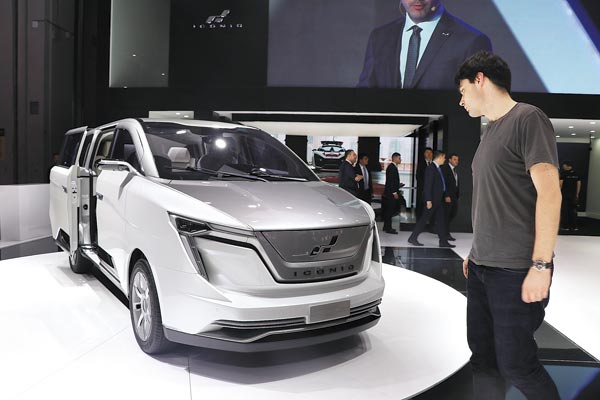 A visitor looks at an Iconiq Seven multi-purpose vehicle at the Shanghai auto show on April 19, 2017. (Photo provided to China Daily) A visitor looks at an Iconiq Seven multi-purpose vehicle at the Shanghai auto show on April 19, 2017. (Photo provided to China Daily)