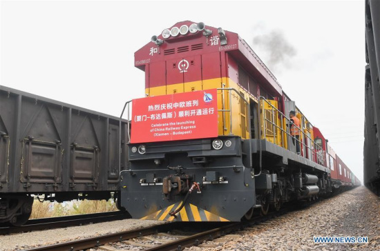 The freight train of China Railway Express (Xiamen-Budapest), linking southeast China's port city of Xiamen with Budapest, capital of Hungary, is seen at Haicang Station in Xiamen, southeast China's Fujian Province, Jan. 19, 2018. The 11,595 km journey, which takes one stop at China's Xi'an, will take 18 days. (Xinhua/Lin Shanchuan) The freight train of China Railway Express (Xiamen-Budapest), linking southeast China's port city of Xiamen with Budapest, capital of Hungary, is seen at Haicang Station in Xiamen, southeast China's Fujian Province, Jan. 19, 2018. The 11,595 km journey, which takes one stop at China's Xi'an, will take 18 days. (Xinhua/Lin Shanchuan)