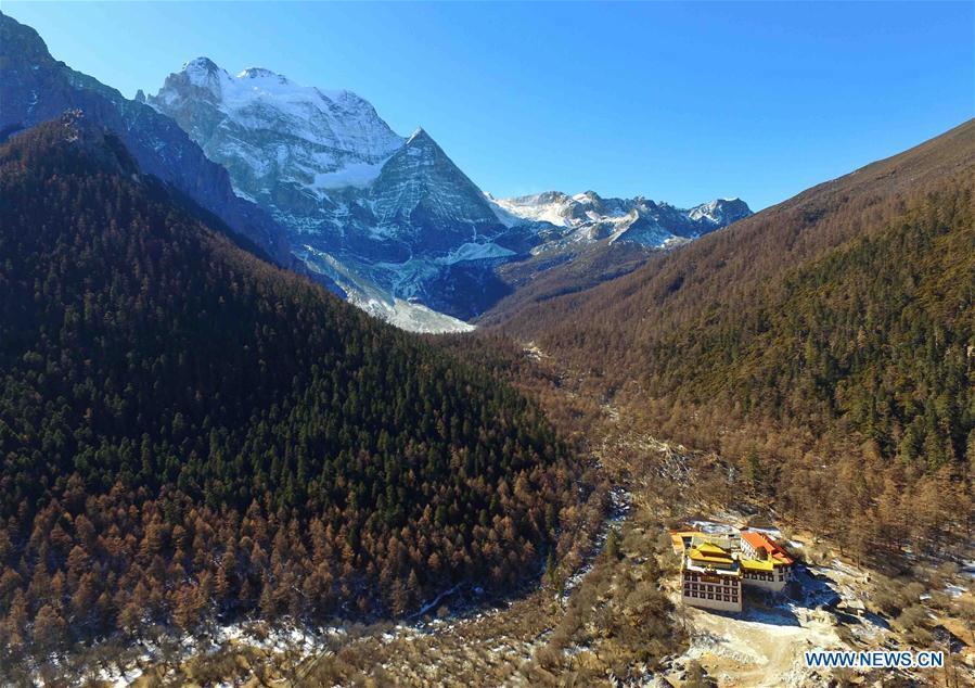 Photo taken on Dec. 31, 2016 shows a temple at the foot of a mountain in Yading Nature Reserve in Daocheng County of Tibetan Autonomous Prefecture of Garze, southwest China\'s Sichuan Province. (Xinhua/Liu Kun)