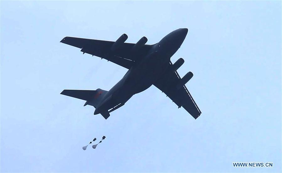 In this undated file photo, China\'s Y-20 heavy transport aircraft takes part in an airborne and air delivery training. China\'s Y-20 heavy transport aircraft has undergone its first airborne and air delivery training, said the Chinese air force on Tuesday. According to Shen Jinke, spokesperson of the air force, it marked a leap in the air force\'s strategic delivery and long-distance airborne combat abilities. (Xinhua)
