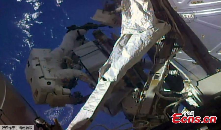 NASA astronauts spacewalk to repair, upgrade space station (1/3)