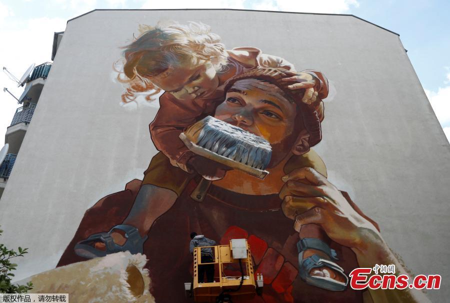 
An artwork by urban artist \'Case Maclaim\' is pictured as part of the first \'Berlin Mural Fest 2018\', where national and international urban artists create a large open-air gallery to enrich urban spaces, in Berlin, Germany, May 21, 2018. (Photo/Agencies)