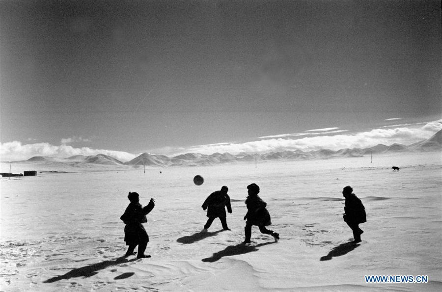 In this file photo issued on Feb. 10, 1990, children play a ball game at a boarding school in southwest China\'s Tibet Autonomous Region. As China celebrates the International Children\'s Day, there arises the occasion for grown-ups to think back over the joys of childhood. With the evolution of technology and lifestyle, children are exposed to a wider range of entertainment. Nevertheless, joy would remain a childhood motif no matter how its forms change with time. (Xinhua/Ma Jingqiu)