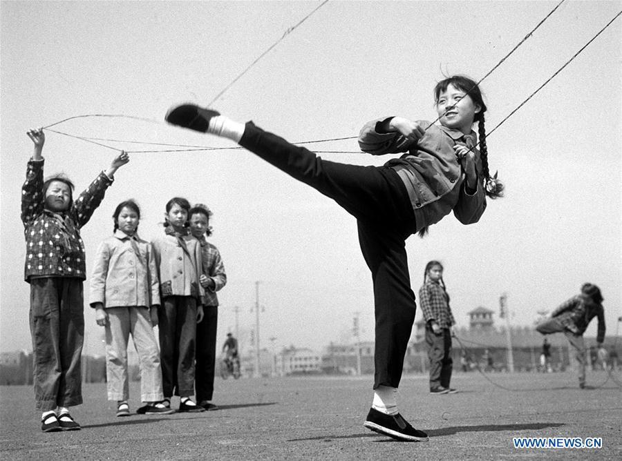 In this file photo issued on July 6, 1963, girls play Chinese jump rope in east China\'s Shanghai. As China celebrates the International Children\'s Day, there arises the occasion for grown-ups to think back over the joys of childhood. With the evolution of technology and lifestyle, children are exposed to a wider range of entertainment. Nevertheless, joy would remain a childhood motif no matter how its forms change with time. (Xinhua/Xia Daoling)