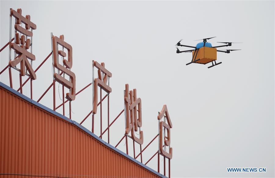 A drone delivers vegetable from a modern agricultural park to an e-commerce warehouse in Wugong County of northwest China\'s Shaanxi Province, April 22, 2018. Over the last few years, unmanned aerial vehicles (UAVs) have increasingly embedded in everyday life all around China. The duties of these civil drones range from agriculture, transportation to entertainment. The commercial sector relies on unmanned platforms for a variety of services, including aerial photography, crop monitoring, rescuing, delivering and performances. The wide use of drones not only makes life more convenient, but also broadens the imagination of Chinese people towards the coming future. (Xinhua/Li Yibo)