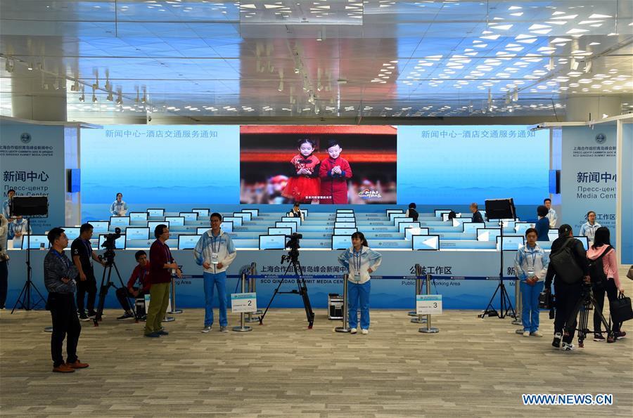 Journalists do preparation work at the Media Center of the Shanghai Cooperation Organization (SCO) Qingdao Summit in Qingdao, east China\'s Shandong Province, June 6, 2018. The media center of the summit will open to journalists from home and abroad from June 6 to 11. (Xinhua/Li Ziheng)