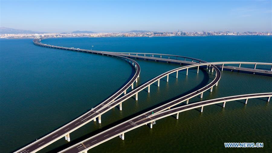 Aerial photo taken on June 1, 2018 shows the Qingdao Jiaozhou Bay Bridge in Qingdao, east China\'s Shandong Province. The 36.48-km cross-sea bridge connects the urban district of Qingdao City to its Huangdao district. (Xinhua/Guo Xulei)