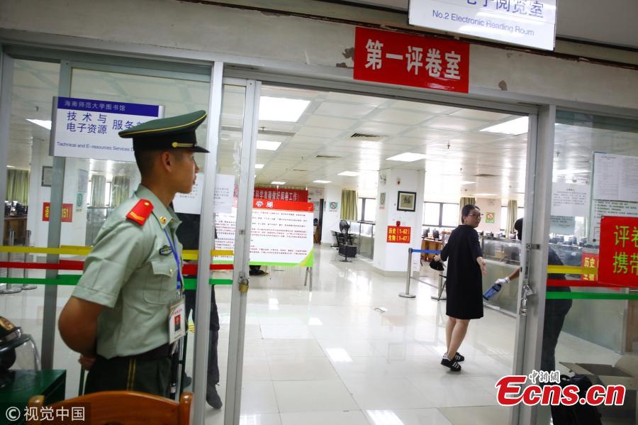 A paramilitary police officer stands guard at a site where the test papers of the national college entrance exam, known as gaokao, are being graded at Hainan Normal University in Haikou City, South China’s Hainan Province, June 12, 2018. The province’s 699 teachers will be responsible for grading gaokao test papers from June 14 to 20 at well-guarded sites. (Photo/VCG)