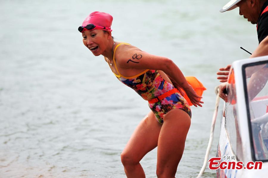A participant competes in a swimming race across the Yellow River in Xunhua Salar Autonomous County, Northwest China’s Qinghai Province, June 24, 2018. The race on China’s second longest river was 500 meters long. (Photo: China News Service/Zhang Tianfu)