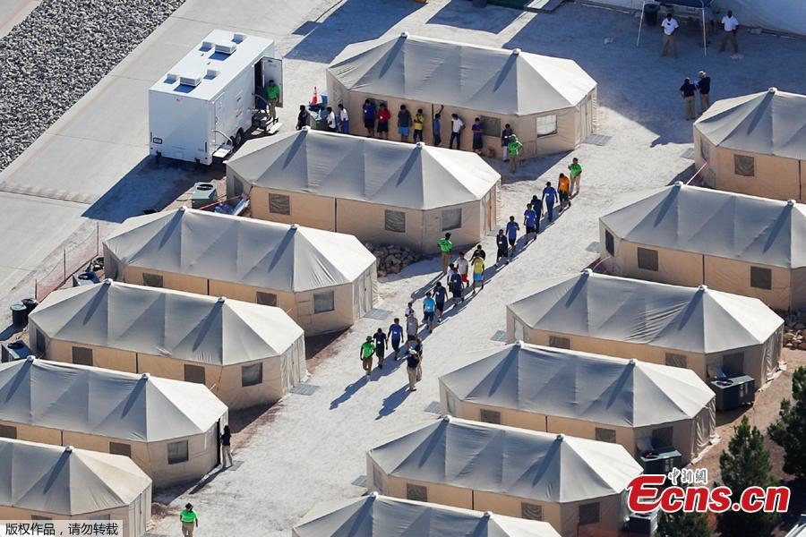 Photo taken June 18, 2018 shows immigrant children, many of whom have been separated from their parents under a new \