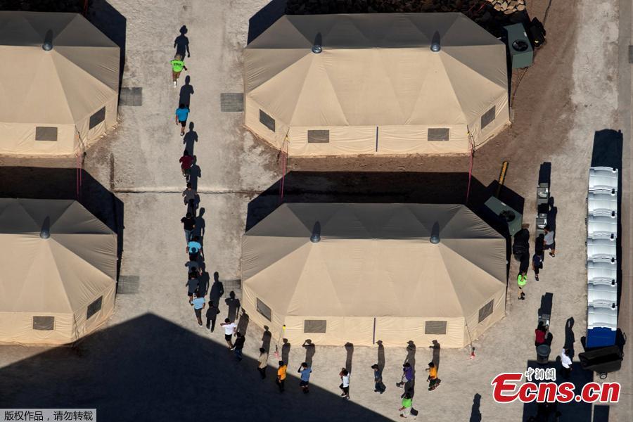 Photo taken June 18, 2018 shows immigrant children, many of whom have been separated from their parents under a new \