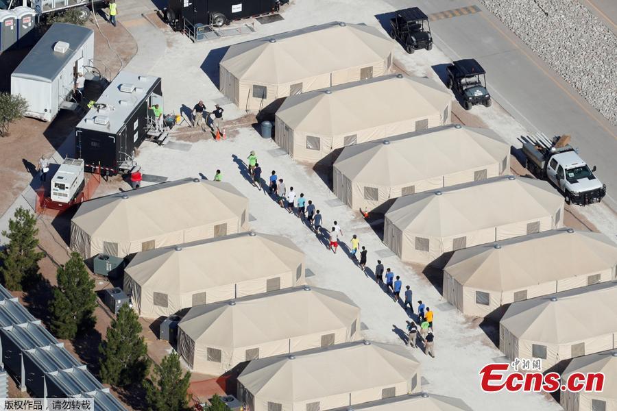 Photo taken June 18, 2018 shows immigrant children, many of whom have been separated from their parents under a new \