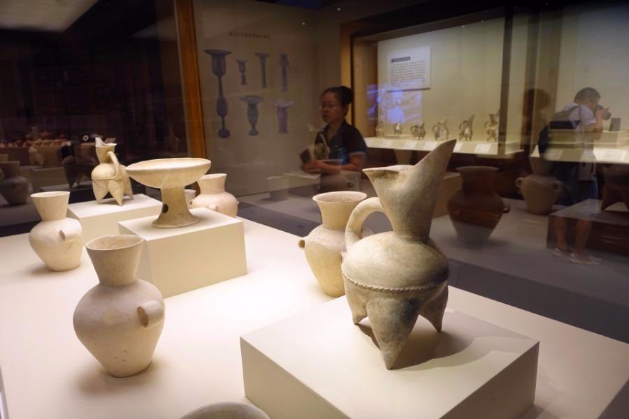 An exhibition featuring Jiaojia relics was unveiled at the National Museum of China on July 10. The exhibition consists of over 230 artifacts, most of which come from the Zhangqiu Jiaojia ruins in Shandong Province. The heritage site was listed as a top 10 archaeological discovery in China in 2017. (Photo/Xinhua)
Covering an area of nearly 150,000 square meters, the relics reveal an extremely rich cultural heritage, including rammed earth walls, ditches, 215 tombs, 116 house sites as well as burial objects such as jade bracelets, pottery cups, white pottery and painted pottery.
The Jiaojia relics site is a link between the preceding Xihe culture of the middle Neolithic Age and the subsequent Longshan and Yueshi cultures. The unearthing filled a gap in the study of residential patterns in the middle and late stage of Dawenkou culture.
