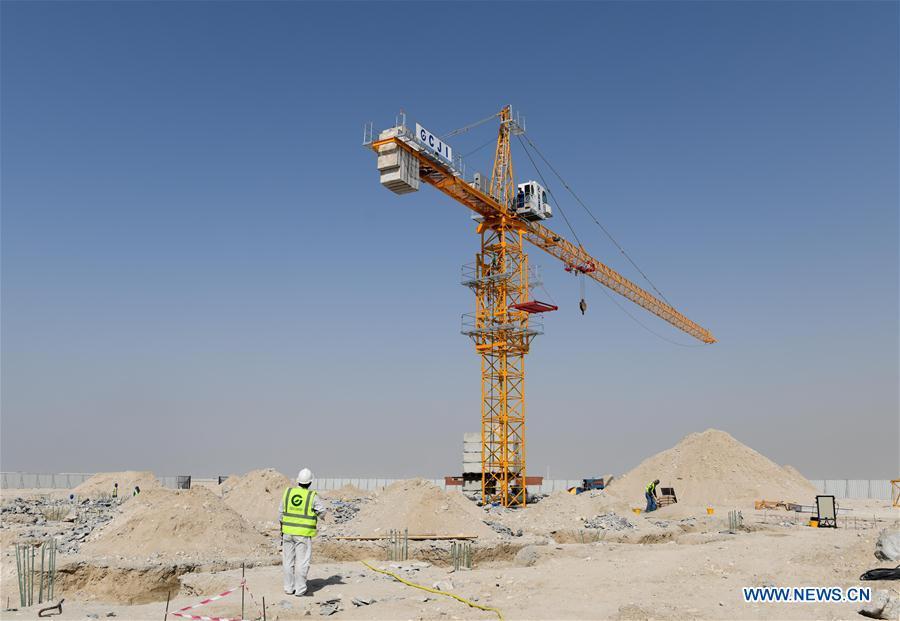 Constructors work at the construction site of the China-UAE Industrial Capacity Cooperation Demonstration Zone, in Abu Dhabi, the United Arab Emirates (UAE), on July 16, 2018. The China-UAE Industrial Capacity Cooperation Demonstration Zone is located in the Khalifa Industrial Zone and covers an area of 2.2 square kilometers, with the main layout of new energy, aluminium products processing, business logistics, petrochemical, food processing and other industries. (Xinhua/Wu Huiwo)