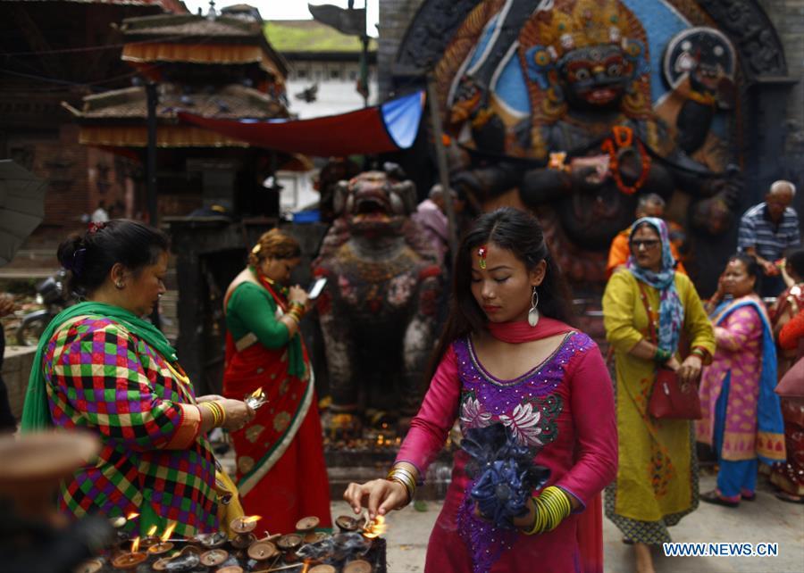 Hindu women offer prayers at Shiva temple in Basantapur in Kathmandu, Nepal, July 23, 2018. Mondays in the holy month of Shrawan are considered auspicious for Hindu women as they fast and offer prayers to Lord Shiva for the long and prosperous life for their husbands. (Xinhua/Sulav Shrestha)