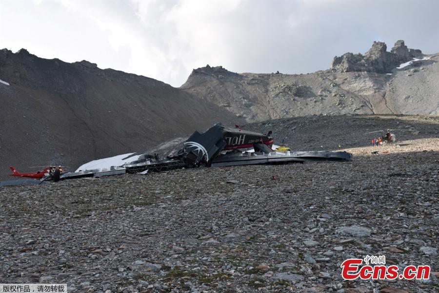 Accident investigators and rescue personnel work at the wreckage of a Junkers JU52 aircraft in Flims on August 5, 2018, after it crashed into Piz Segnas, a peak in eastern Switzerland on August 4. Twenty people are confirmed dead after a vintage World War II aircraft crashed into a Swiss mountainside, police reports said. The Junker JU52 HB-HOT aircraft, built in Germany in 1939 and now a collector’s item, belongs to JU-Air, a company with links to the Swiss air force, the ATS news agency reported. (Photo/VCG)