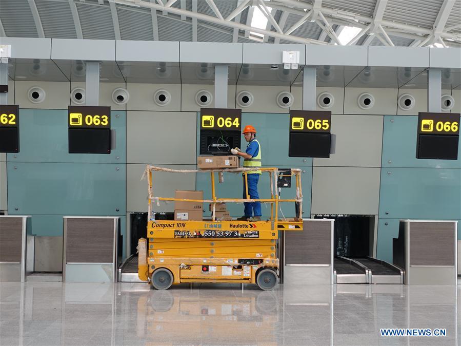 Photo taken on Aug. 10, 2018 shows a Chinese worker installing equipment at the passenger departure hall of the new Algiers Airport in Algeria. The construction of new Algiers Airport by China State Construction Engineering Corporation (CSCEC) will be completed soon. (Xinhua)