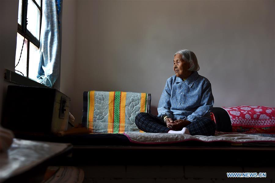 Li Ailian sits on the bed in Shaoqu Village of Wuxiang County, north China\'s Shanxi Province, Aug. 3, 2016. Li died on Jan. 23, 2018 at the age of 90. In the summer of 1945, Li was abducted and abused regularly by Japanese invaders for over 50 days. Women forced into sexual slavery by the Imperial Japanese Army before and during World War II were called \