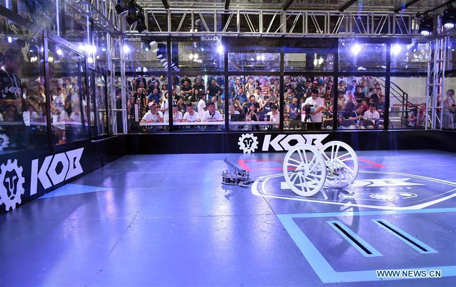 Photo taken on Aug. 15, 2018 shows a robot wrestle contest at World Robot Conference 2018 in Beijing, capital of China. Kicking off on Wednesday, the conference attracted more than 160 domestic and international corporations exhibiting their cutting-edge products in the robotics industry. (Xinhua/Li Xin)